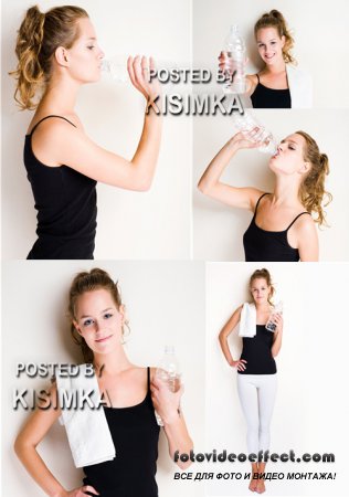 Stock Photo: Young blond fitness woman with a water bottle